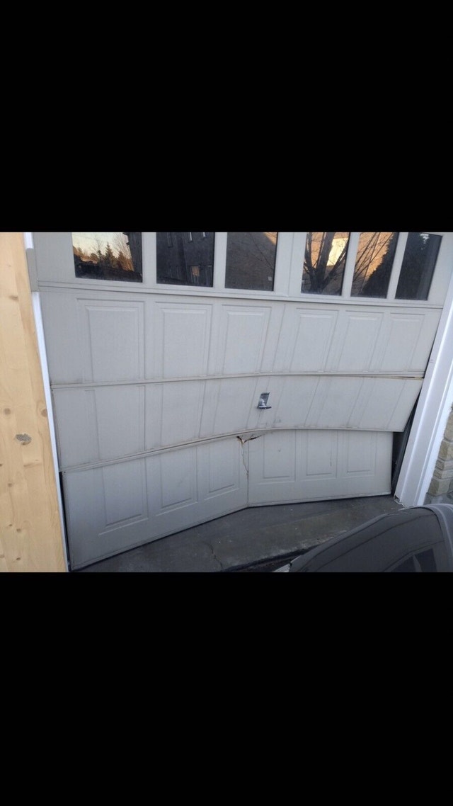 GARAGE DOOR REPAIR BROKEN SPRING REPLACEMENT 9059193207 Garage Door Mississauga / Peel