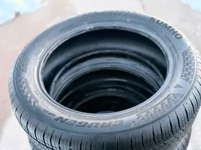 set of like new (used 1 day before switching to winters) Kumho Crugen HP71 tires. Size is 215/55/18....