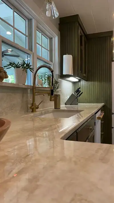 Experience timeless elegance with Taj Mahal Quartzite kitchen countertops featuring a stunning green...