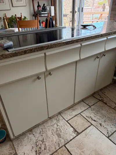 American red oak, painted white. U-shaped kitchen, with the peninsula at 8.5 feet long with a built-...
