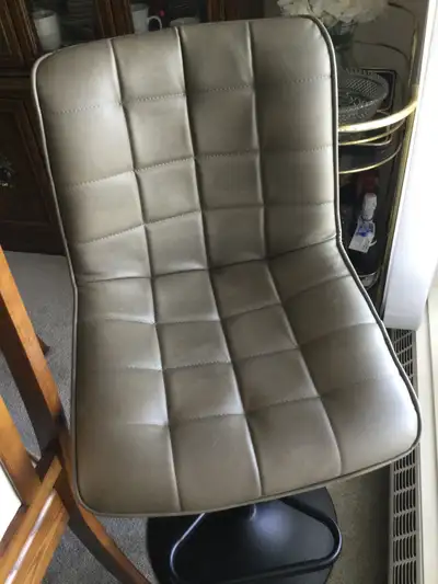 Taupe colour, soft cushioned easy to spot clean fabric. Height of seat can be adjusted with power le...
