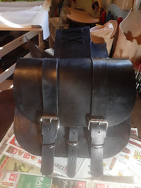 Old fashioned leather throwover saddlebags for motorcycle