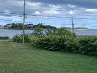 Move to Nova Scotia and have ocean view property with a wharf