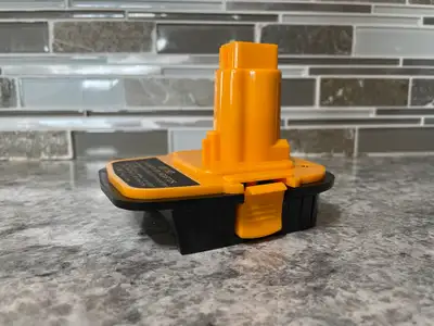 Brand new (unused) 3rd party battery adapter that allows you to use your DeWalt 20V Max batteries wi...