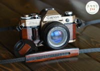 Canon AE-1 film camera (brass / brown)