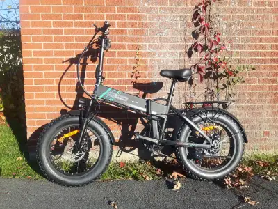 Electric bike. Selling as is. - only 4 miles on the odometer - pedal assist - folding ability, but d...