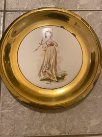 Antique brass framed ceramic wall hanging plate. 9.5”.