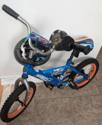 Good condition,Hotwheels bicycle, helmet for 4- 8 years old kid, View more