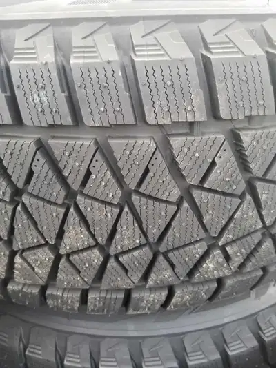 New Bridgestone BLIZZAK DM-V2 - IS 265/65R17 112R SL $ 1025 plus hst per set of 4 tires NEW rims add...