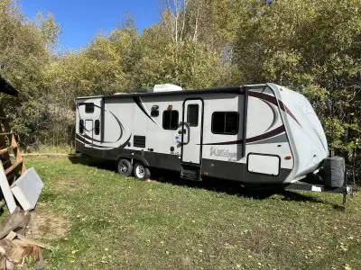 2013 Forest River Wildcat. Great condition. 29’ sleeps 9. Dark wood finish on inside. Bunk room and...
