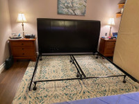 Heavy duty metal king size bed frame and leather headboard.