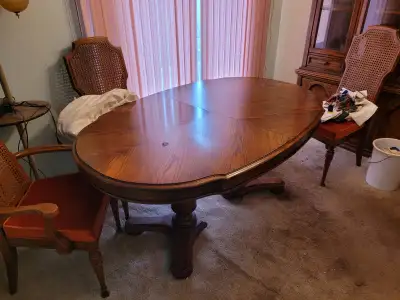 Selling a wood table with upholstered chairs. Please note the table has a mark on the top of it (ref...