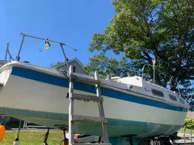 22 sailboat, complete. solid, no soft spots. good selection of sails, have a couple of tins of botto...