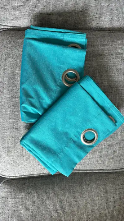 Excellent condition blackout curtains. Teal colour Grommet panel Both panels are 64” long Each one i...