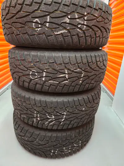 Set of 4 Uniroyal brand Winter Truck Tires mounted on steel rims. Tire Size: 245/65R17 (17" rim, 245...