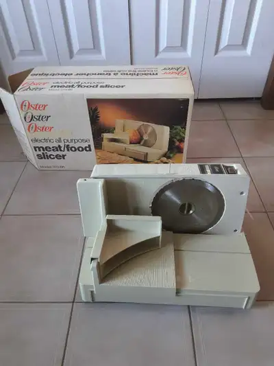 Oster Meat Slicer Received as a wedding gift years ago. Used one time. This unit is essentially new...