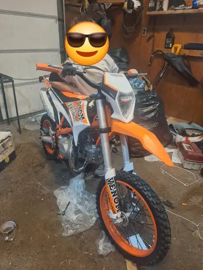 14 hours on bike just bearly broken in. This is a 4 speed with a clutch 4 stroke engine and the fram...