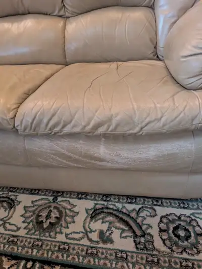 Free- matching set of tan coloured sofa and chair. No tears in material and very comfortable. They s...