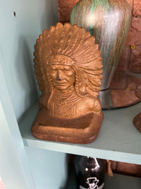 Indigenous cast bookend , proud Native American Indian chief. 