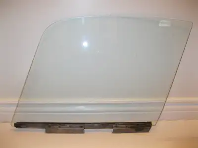 I have an original (OEM) driver's side drop glass for a Jaguar E Type S1 or S2 FHC. The glass is in...