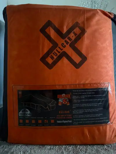 Hullcar-X Hail cover essentially brand new. Office was outdoor surface parkade, located in typical C...