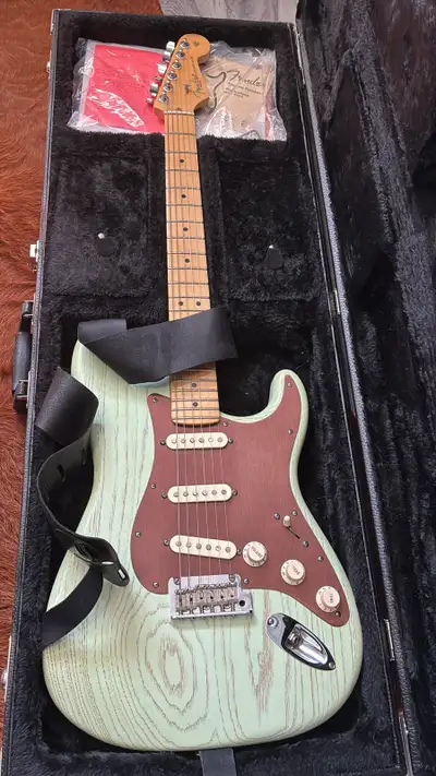 American strat in “surf green” - modern “C” neck profile - satin finish, gloss finish on front of ne...