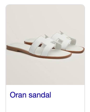 White Hermès Oran sandals in size 37/7 including dust bag.