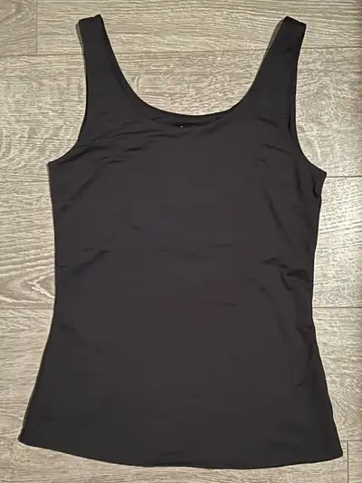 Size Small Black Tank Top. Silky and cooling material, perfect for warm weather or as an undershirt.