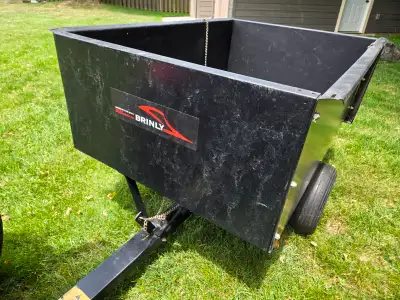 Brinly (made in USA) 16 cubic-foot, 1200-pound capacity, powder-coated steel dump cart. Pneumatic ti...