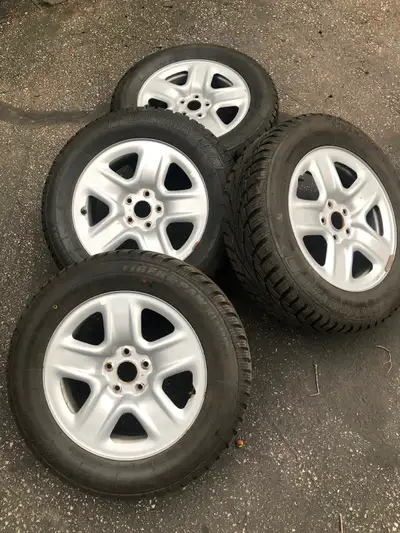 Four 225/65R17 Uniroyal (Tiger Paw Ice & Snow) winter tires Four Toyota factory rims 5x114.3 bolt pa...