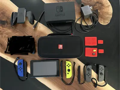 Nintendo Switch Bundle with 4 Controllers, hard case, 2 microSD, View more