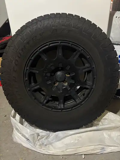 selling 4 225/75R15 toyo open country AT tires on method race wheels. 5x100 bolt pattern. came off a...