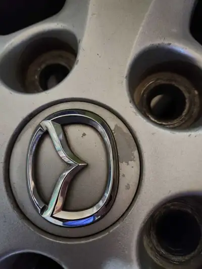 Mazda 5 original rims, 5 door 2 all season tires on rims and 1 no rim. 3 available Size 205 R 17