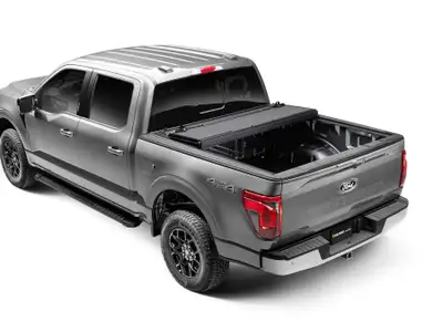The hard cover that provides full access to the bed. Featuring a sleek, “no profile” design, this un...