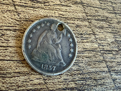 SEATED LIBERTY 1857 HALF DIME 90% SILVER. VERY NICE COIN BUT HOLED PHILADELPHIA MINT