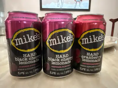 Enjoy a refreshing mix with these cans of Mike's Hard Lemonade, featuring black cherry and cranberry...