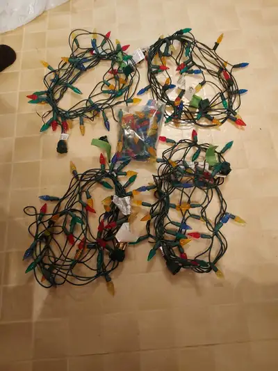 Sets of Christmas lights. 4 sets of 35, 9 ft with a bag of spare bulbs. 2 sets of 25, 8.5 ft. All wo...