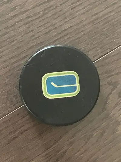 1970’s NHL Vancouver Canucks game used hockey puck Vintage, View more