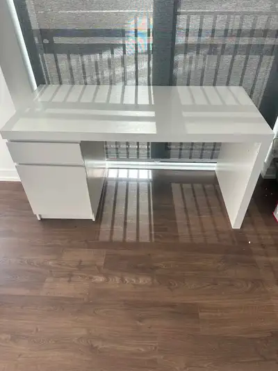 This pre-loved IKEA MICKE desk features a clean, white minimalist design perfect for any modern home...