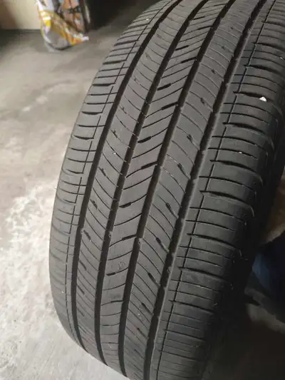 Set of 4 Kumho Solus TA31+ all-season tires mounted on original Kia alloy rims. Used for only one se...