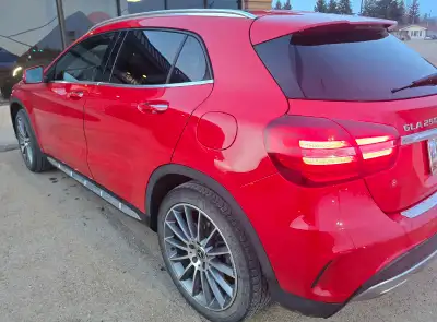 Low KM 2018 Jupiter Red Mercedes Benz GLA 250. Excellent condition. Loaded. Black interior. Heater l...