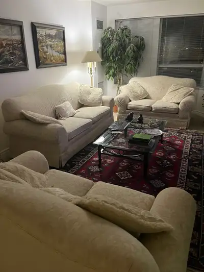 Matching cream-colored loveseats (2) and couch (1)., View more
