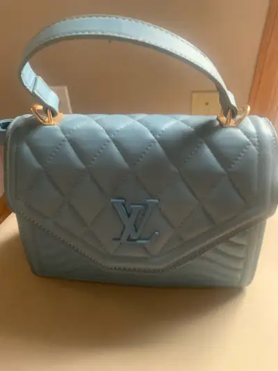 Light Blue Quilted Handbag with FAKE Louis Vuitton Logo, View more