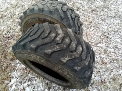 Tractor tires and wheels. Tires all have cracks, but useful to the right person. 65.00 for the two 1...