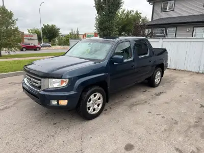 2010 Honda Ridgeline VP Crew Cab 4WD In good condition, smooth drive with lots of space and storage....