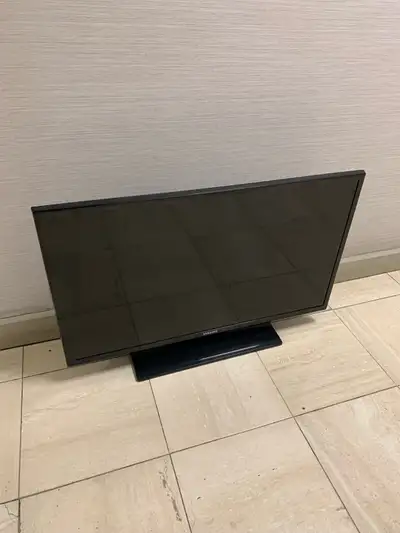 Used Samsung 32-inch HDTV. Black. Includes stand. Various ports, including HDMI and USB. Model numbe...