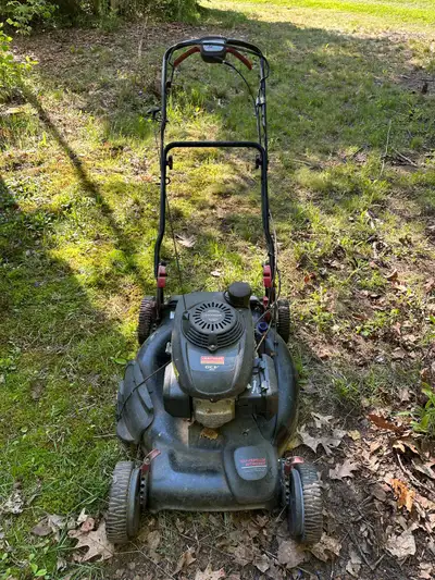 This Craftsman self-propelled lawn mower, featuring a reliable Honda GCV 160 engine and ez2walk tech...