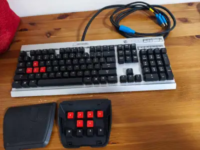 It's a gently used mechanical keyboard from Corsair. With aluminum panel and a few replacement keyca...