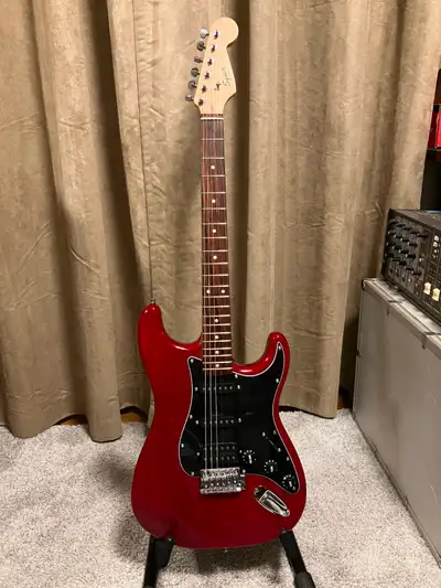 Nice Trans/Red body, Upgraded Tuners, Bone Nut, Roller Tree. All new electronics w/ceramic magnet pi...