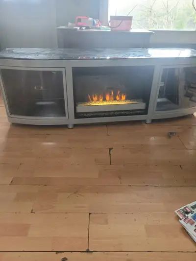Obo Still Available Add a touch of warmth and elegance to your living space with this used electric...